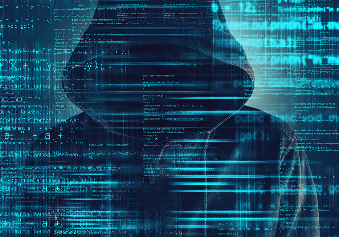 Cybersecurity, computer hacker with hoodie and obscured face, computer code overlaying image. The Cybersecurity View from ITEXPO